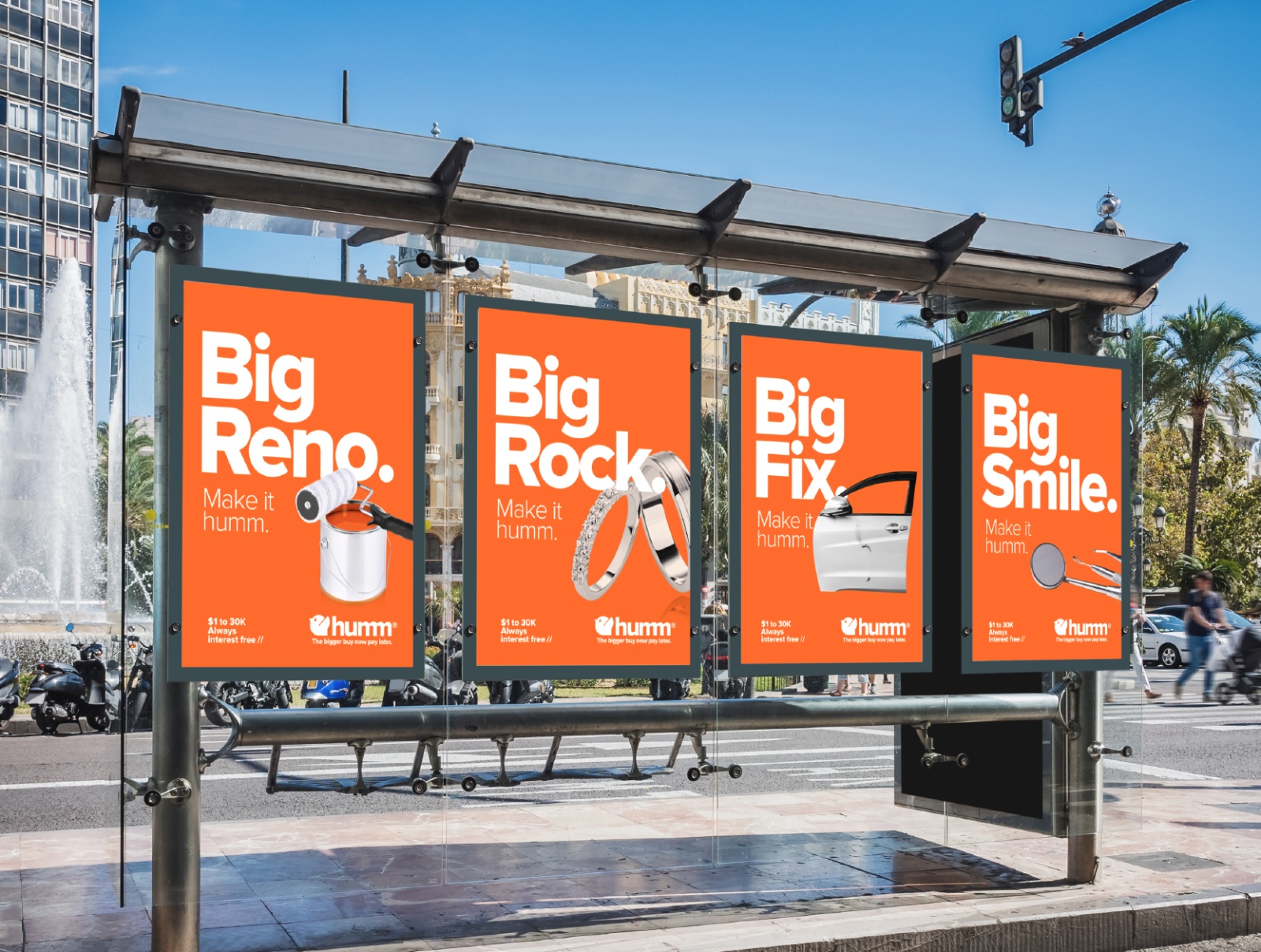 humm 'Big Reno. Big Rock. Big Fix. Big Smile. Make it humm.' out-of-home posters in a bus shelter.